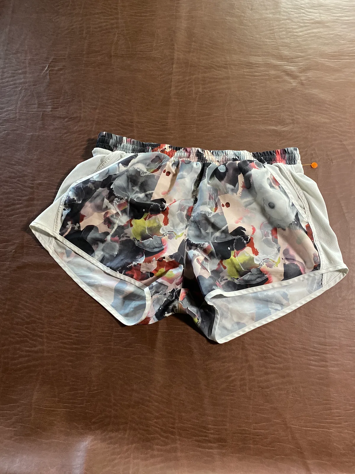 Multicolor Under Armour heat gear running shorts